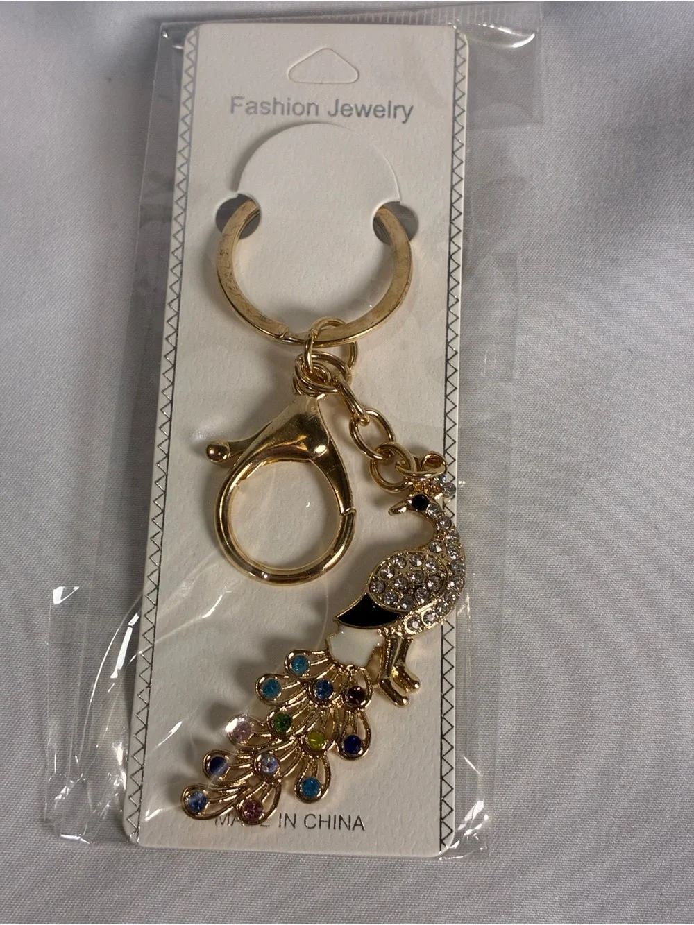 Gold Peacock Keychain with Black and Multicolor Crystal Accents